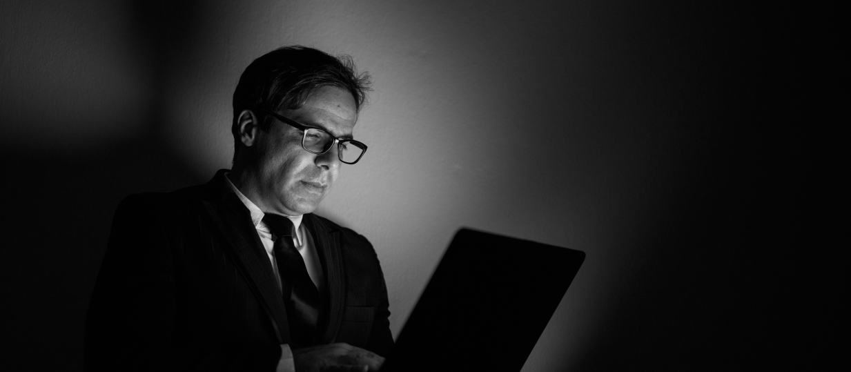 Professional businessman working on laptop